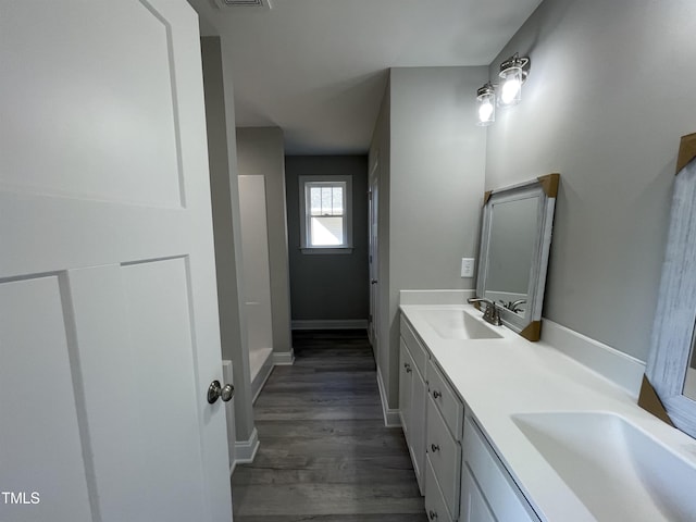 bathroom featuring vanity and hardwood / wood-style floors