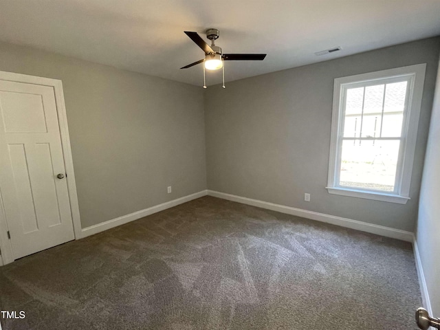 empty room with carpet flooring and ceiling fan