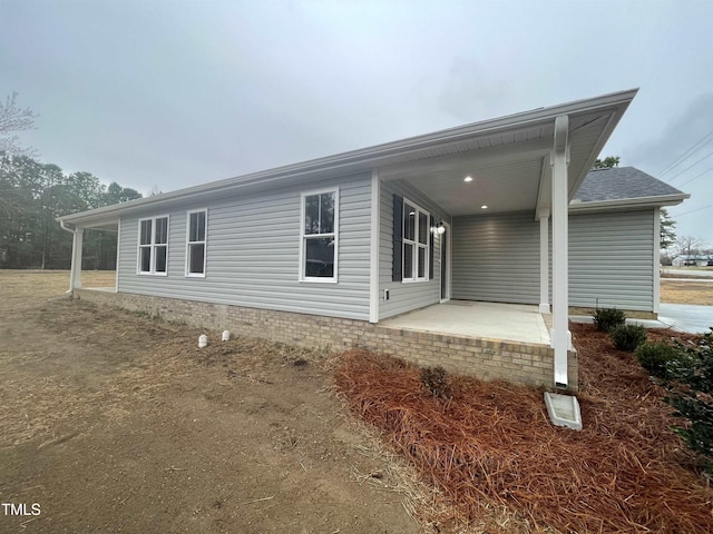 rear view of house featuring a patio