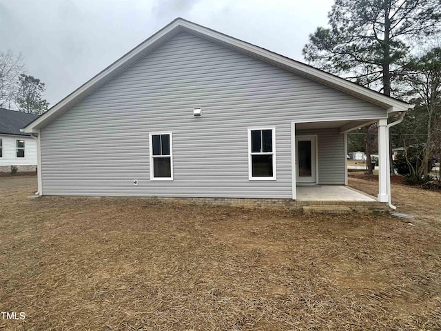 rear view of property with a patio area