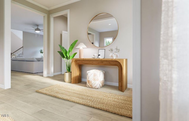 hallway with hardwood / wood-style floors and crown molding