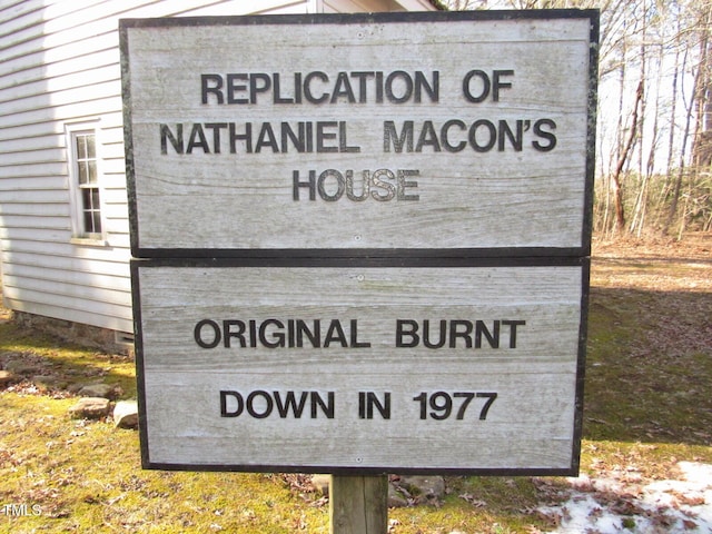 community / neighborhood sign featuring a garage