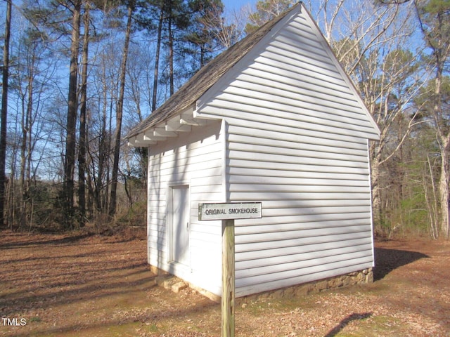 view of home's exterior featuring an outdoor structure