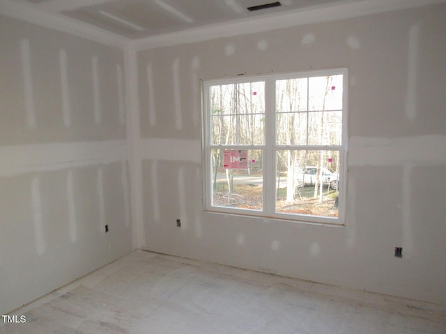 empty room featuring visible vents and a wealth of natural light