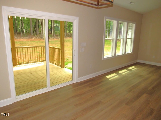 122 Beaver Trl, Littleton, NC 27850 - doorway to outside featuring baseboards and wood finished floors