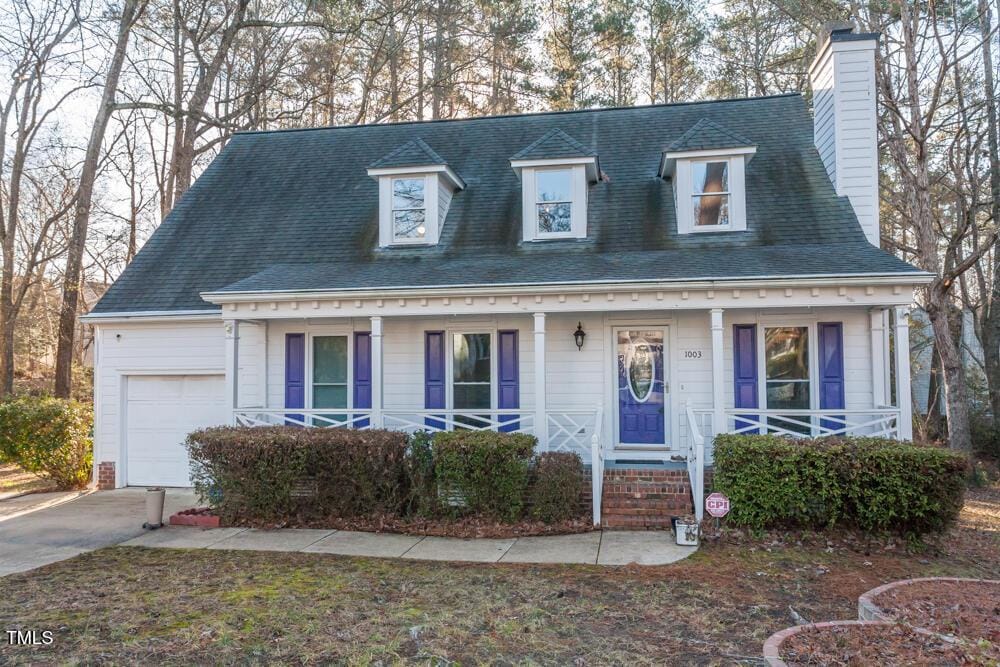 view of front of home featuring a garage and covered porch