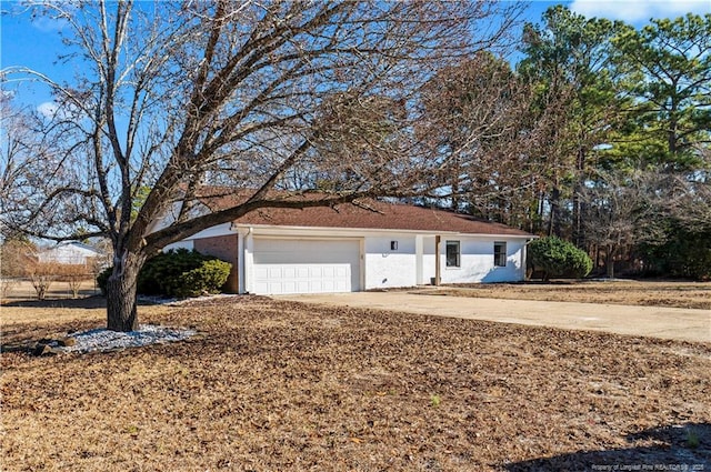 ranch-style house featuring a garage