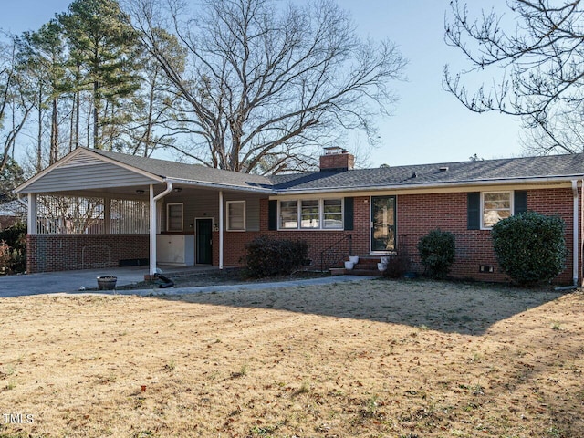 single story home featuring a front lawn and a carport