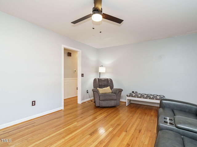 living area with ceiling fan and light wood-type flooring