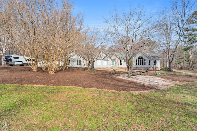 view of front of house with a front yard and crawl space