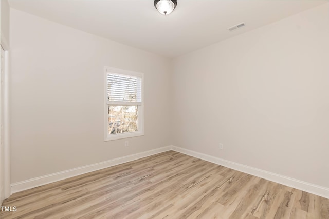 empty room with light hardwood / wood-style floors