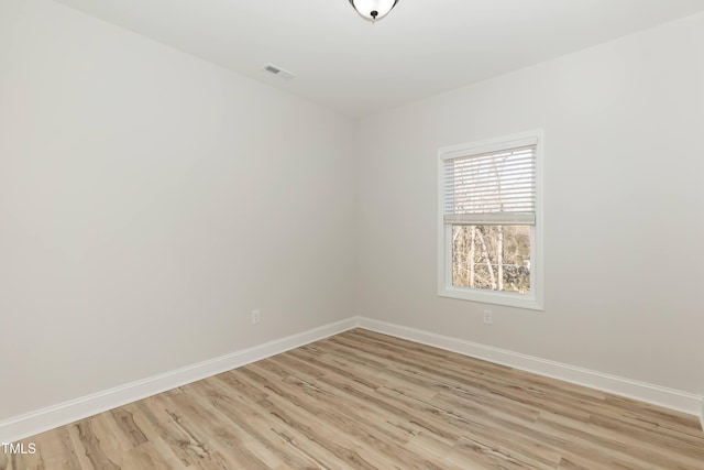 unfurnished room featuring light hardwood / wood-style floors