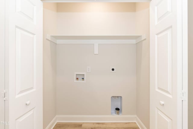 laundry area with hookup for an electric dryer, hookup for a washing machine, and hardwood / wood-style floors