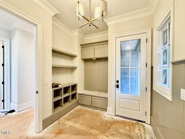 mudroom featuring a notable chandelier and crown molding