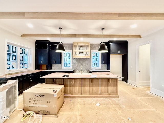 kitchen featuring tasteful backsplash, a center island, and pendant lighting