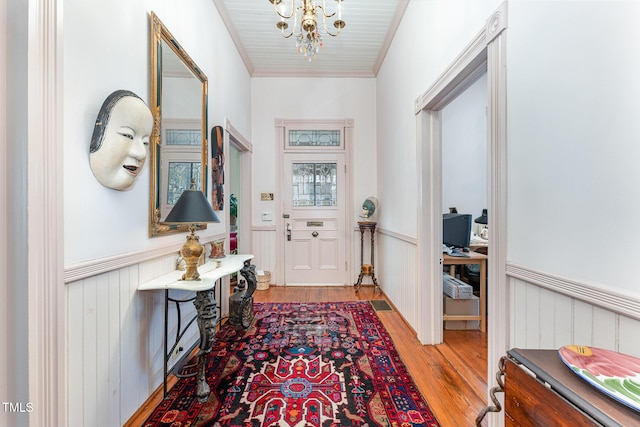 entryway featuring wood ceiling, light hardwood / wood-style flooring, and a notable chandelier