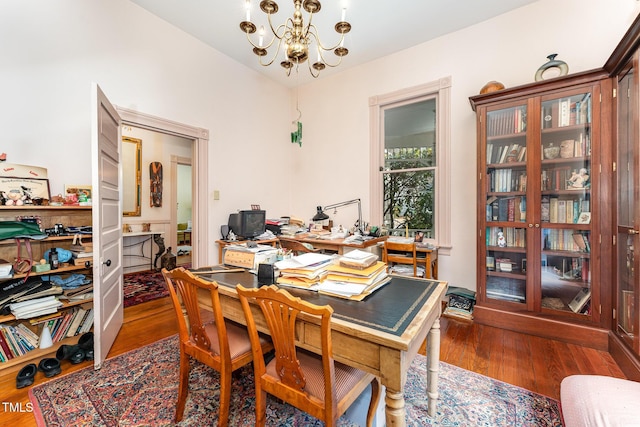 office featuring dark hardwood / wood-style flooring and a notable chandelier