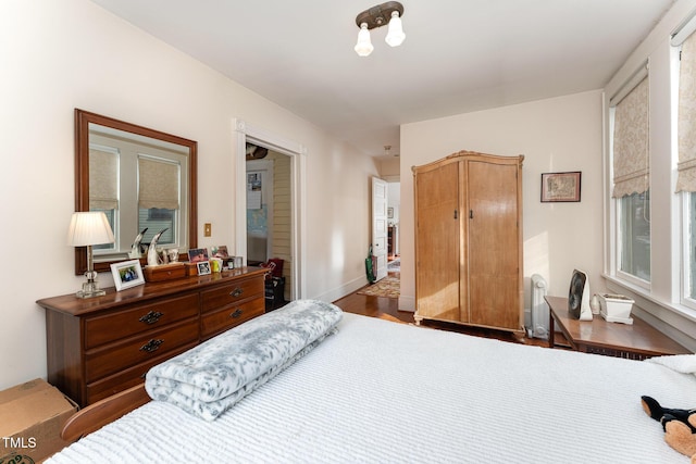 bedroom with hardwood / wood-style flooring