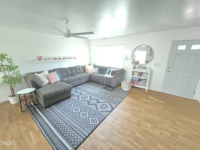 living room with ceiling fan and hardwood / wood-style floors