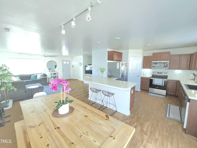 dining room featuring light hardwood / wood-style flooring and sink