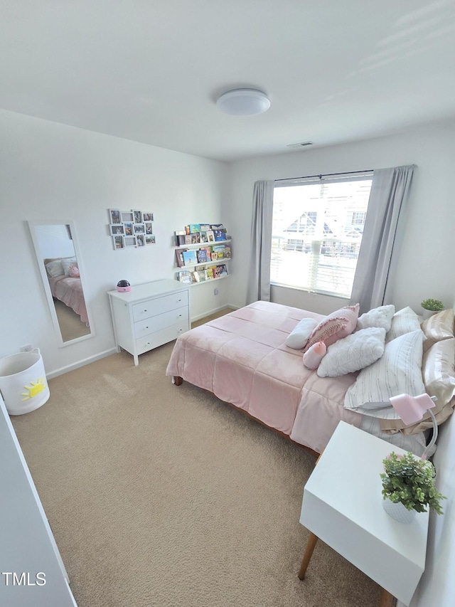 bedroom with light carpet