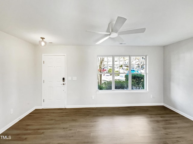 interior space featuring ceiling fan and dark hardwood / wood-style flooring