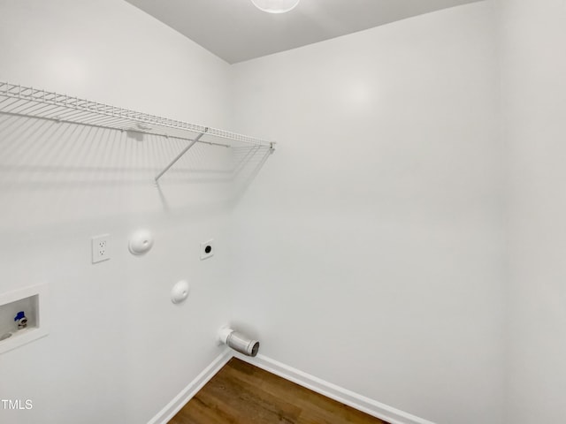 clothes washing area featuring washer hookup, gas dryer hookup, electric dryer hookup, and hardwood / wood-style floors