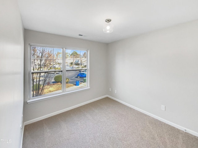 spare room featuring carpet