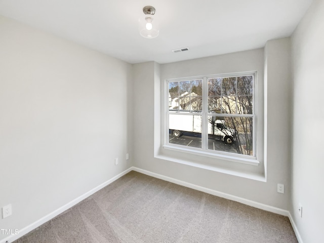 view of carpeted spare room