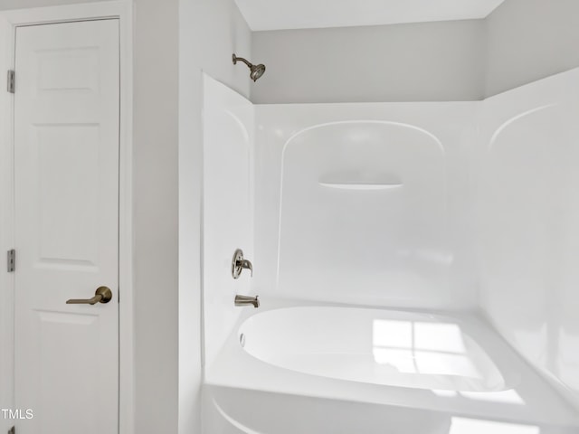 bathroom with shower / washtub combination