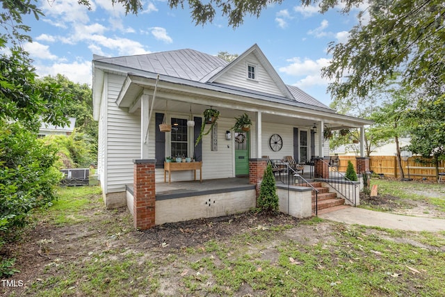 view of front of home with central AC and covered porch