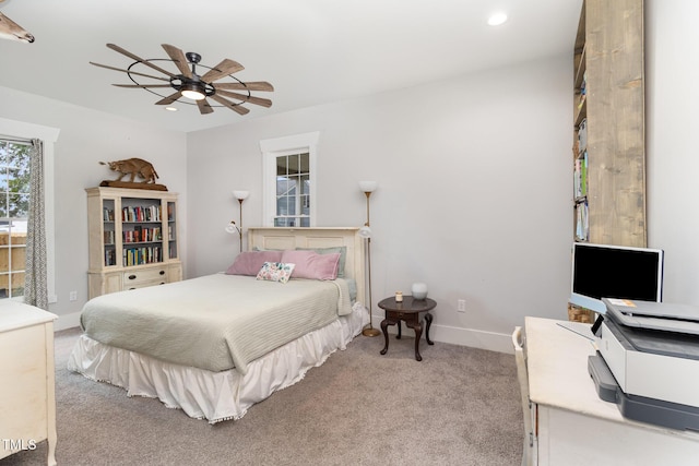 bedroom featuring ceiling fan and light colored carpet