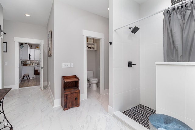 bathroom with toilet and walk in shower