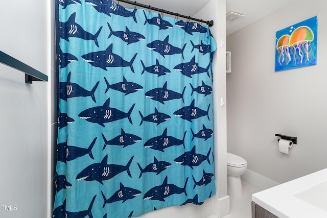 bathroom featuring walk in shower, tile patterned floors, and toilet