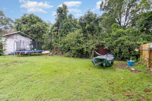 view of yard with a trampoline