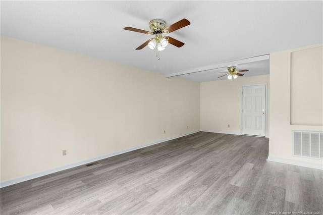 spare room with hardwood / wood-style flooring