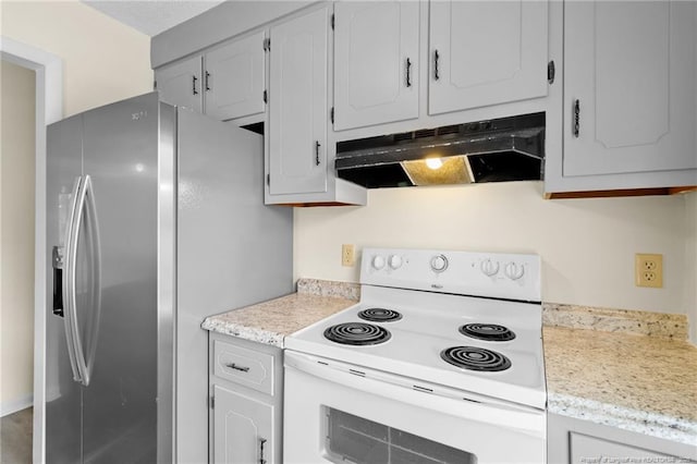 kitchen with white cabinetry, electric range, and stainless steel fridge