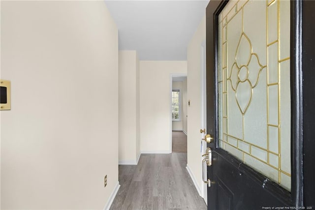 hallway with light wood-type flooring