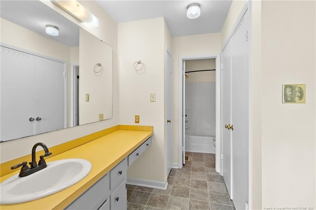 bathroom featuring vanity and washtub / shower combination