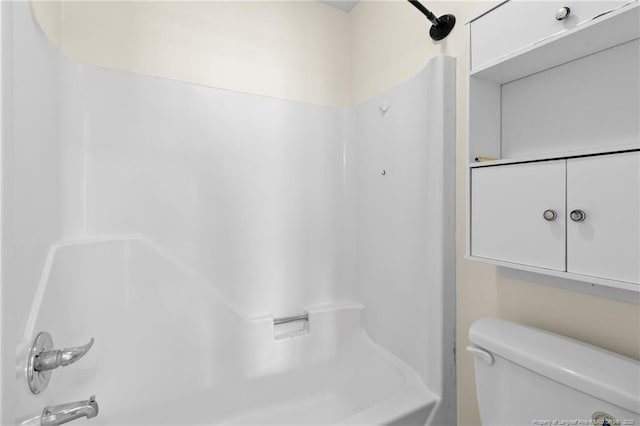 bathroom featuring  shower combination and toilet