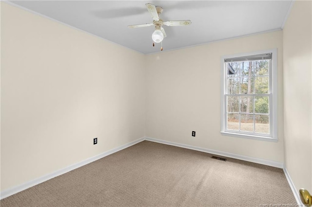 carpeted empty room featuring ceiling fan