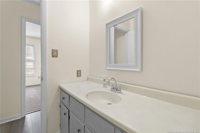 bathroom featuring hardwood / wood-style flooring and vanity