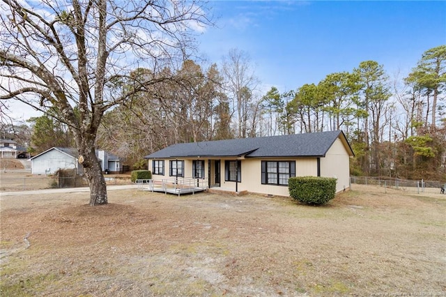 view of front of property with a wooden deck