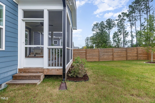 view of yard featuring a sunroom