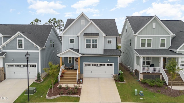 craftsman house featuring a garage, covered porch, and a front yard