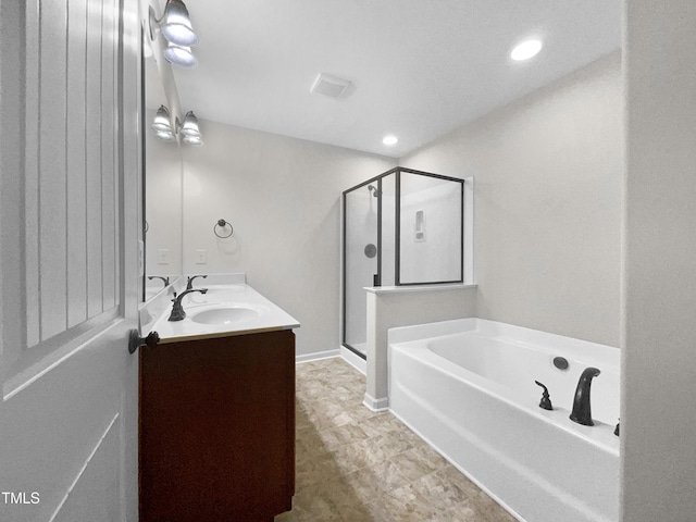 bathroom featuring vanity and shower with separate bathtub