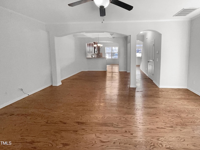 unfurnished living room featuring crown molding, hardwood / wood-style floors, and ceiling fan with notable chandelier