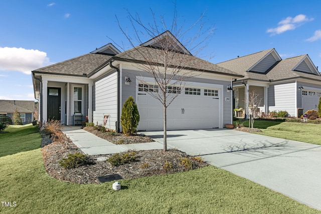 view of front of home featuring a garage and a front yard