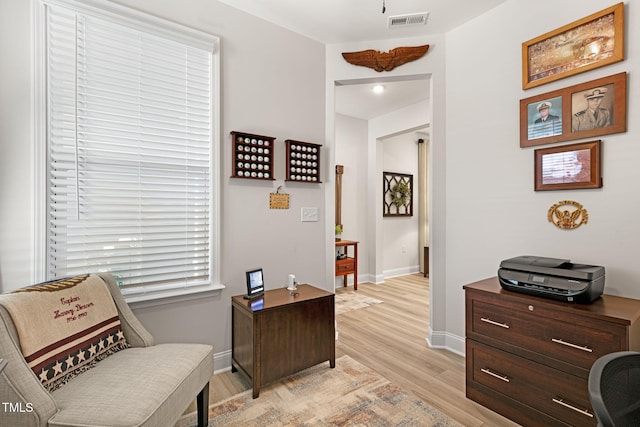 sitting room featuring light hardwood / wood-style floors