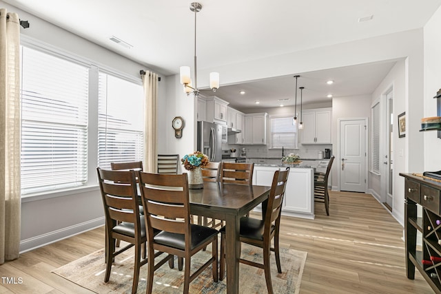 dining area with light hardwood / wood-style floors